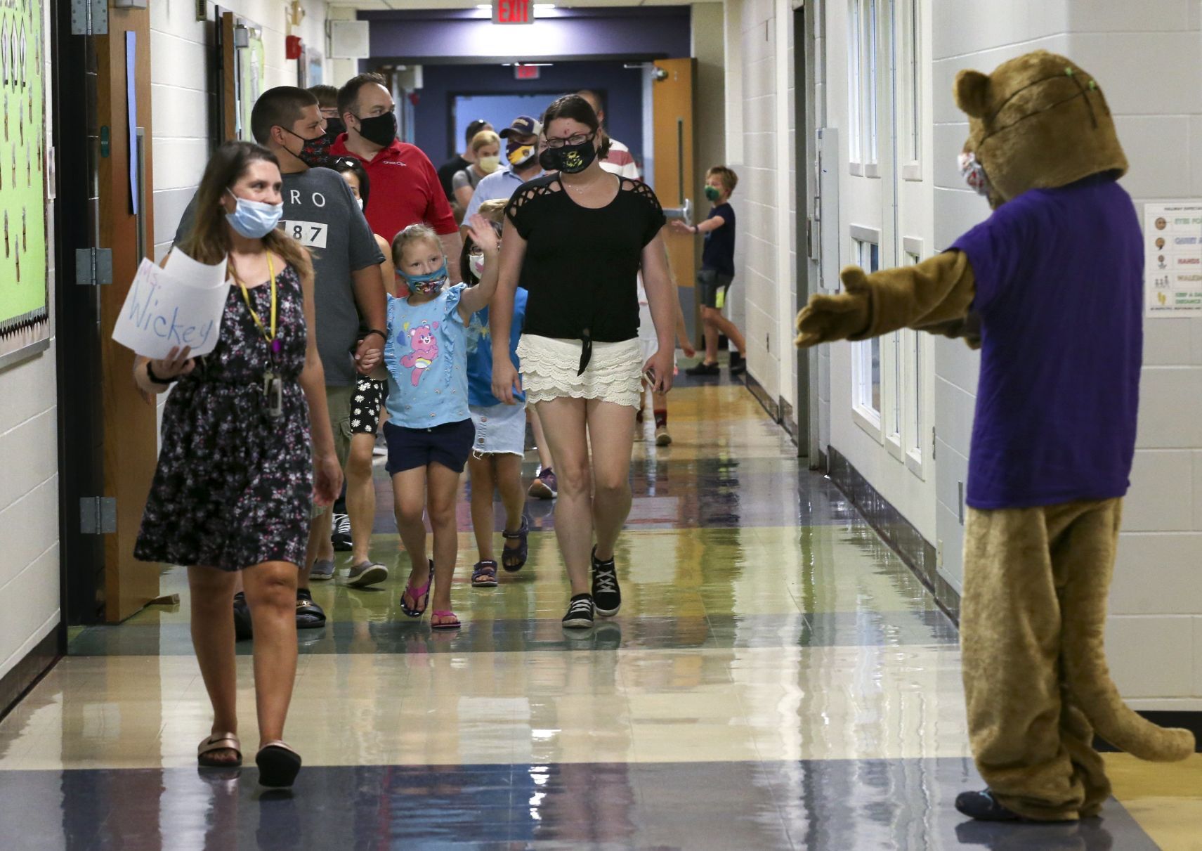 Waving to the Cougar mascot during open house